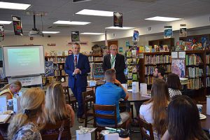 Administrators present to new faculty members in a school library