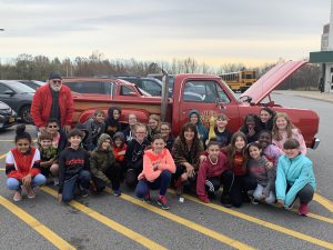 students and red truck