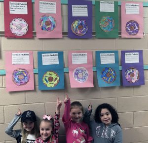 students with doughnut writing project