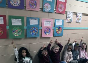 students with doughnut writing projects