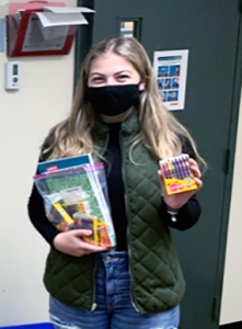 FBLA member with school supplies