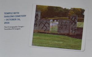 photo of defaced cemetery walls