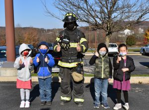 Firefighter with students