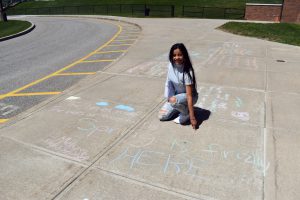 student with chalk art