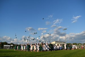 senior tossing caps in air