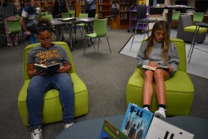 students reading in library