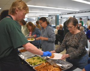 seniors being served food
