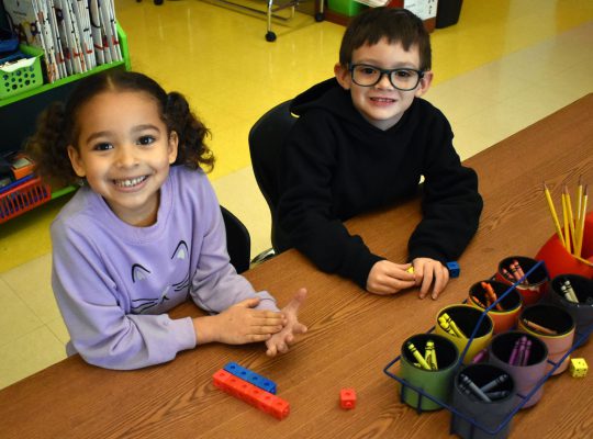 students with math cubes