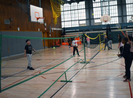 students playing in gym class