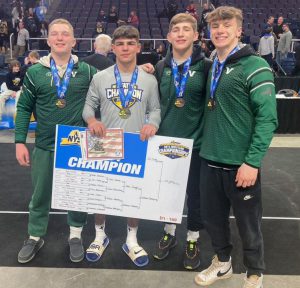 four wrestlers with medals 